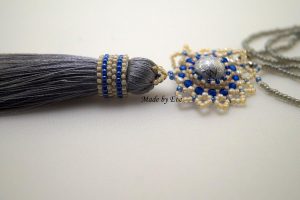 a jewelry set with a tassel