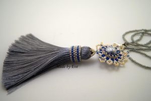 a jewelry set with a tassel