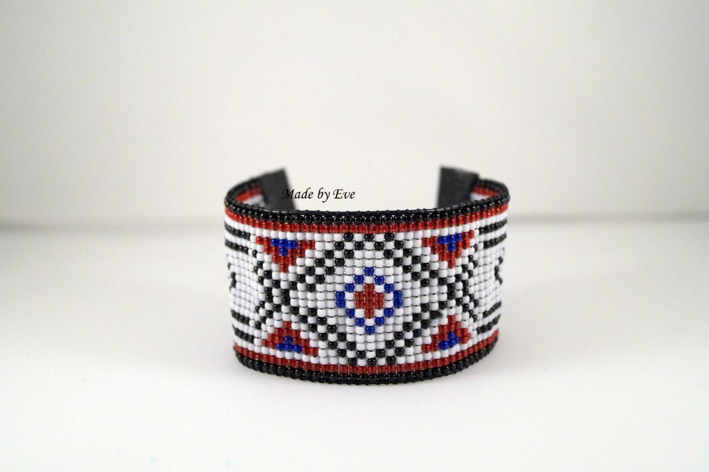 A white and black-red bracelet