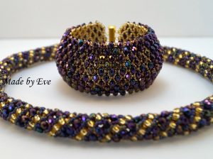 a gold and purple jewelry set