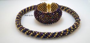 a gold and purple jewelry set