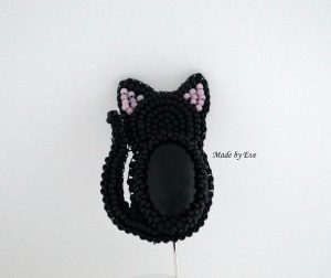 a brooch with onyx "black cat"